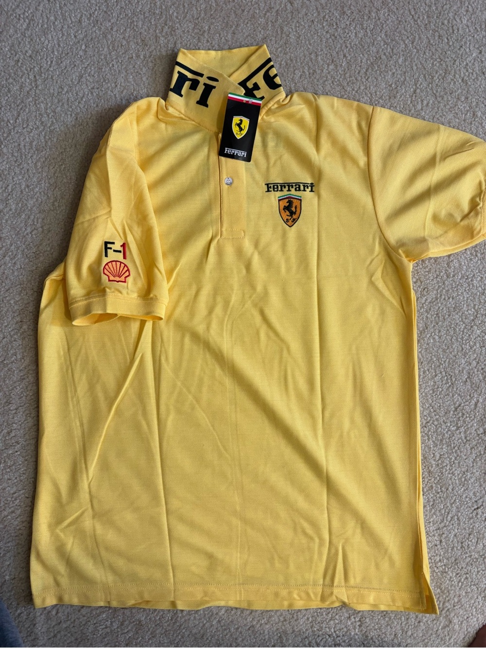 New with tag (sz XL FIT L )Ferrari Navy Polo with Yellow Shield and Red Accents